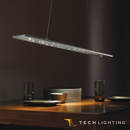 crockery underneath a small, wide pendant