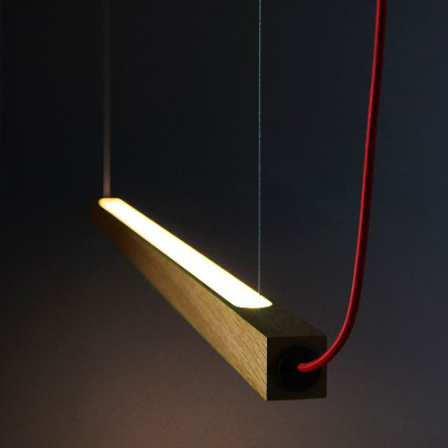 brown light housing held with red cables brown light housing held with red cables